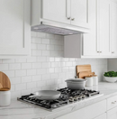 36 inch range hood insert above cooktop in a modern kitchen