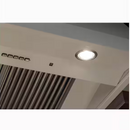 Café wall mount range hood with LED lights illuminated for bright kitchen cooking area