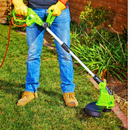Electric Lawn Trimmer removing weeds and overgrown grass for clean landscape maintenance - Action View
