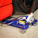 Hydraulic floor jack lifting a red car during automotive repair and maintenance