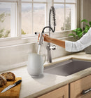 Kohler Haku pull-down kitchen faucet in use