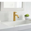 Modern bathroom with brushed gold sink faucet