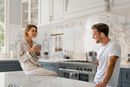 Modern kitchen with VIKIO insert range hood during everyday cooking